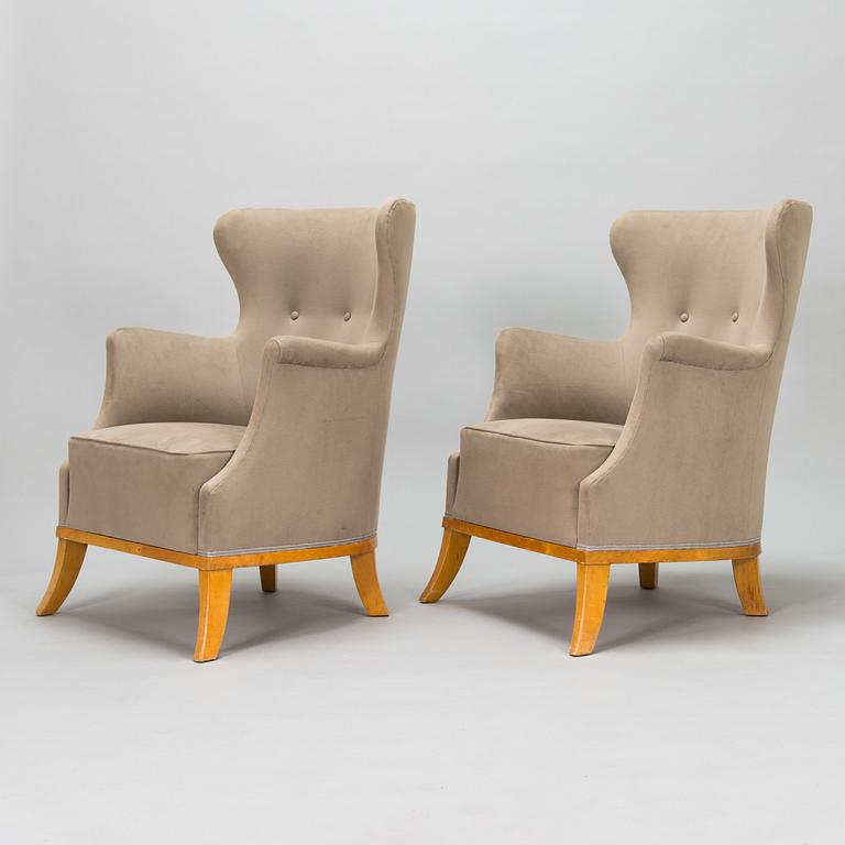 A pair of mid 20th century armchairs.