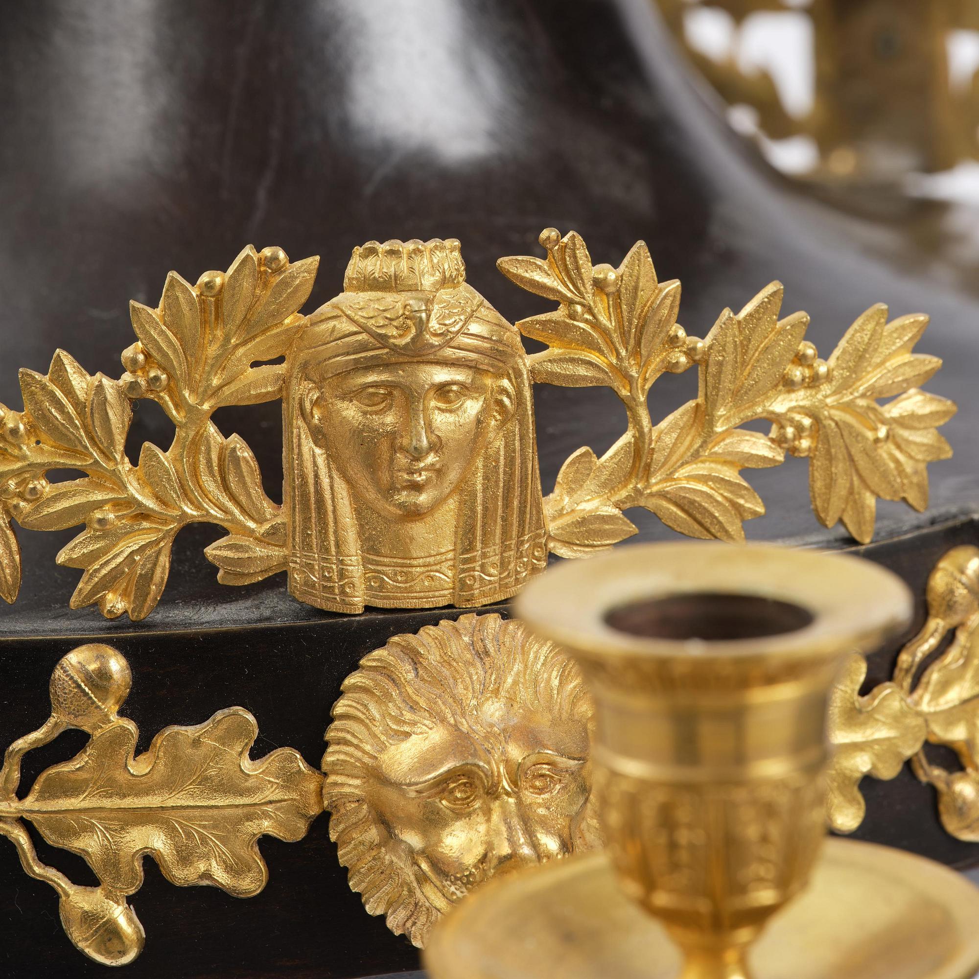 A patinated and ormolu six-light Empire chandelier, Stockholm, first part 19th century.