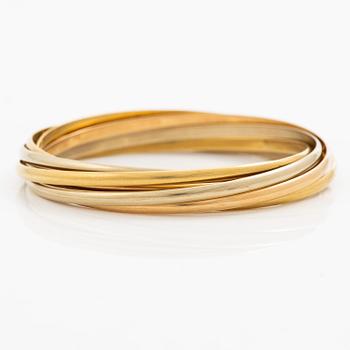 A Cartier bangle "Trinity" 18K gold in three colours.