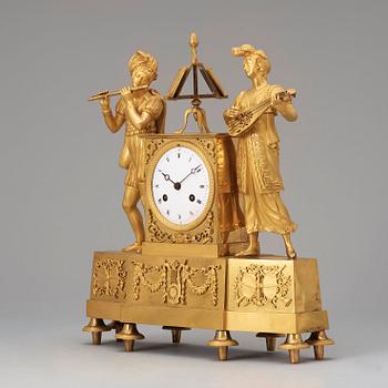 A French "Style troubadour" 19th century gilt bronze mantel clock.