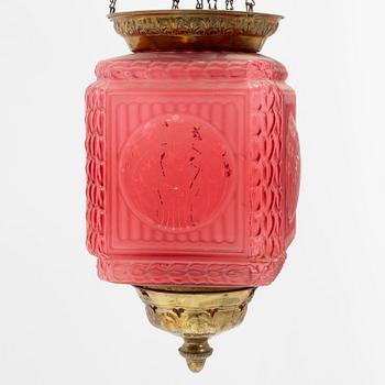An art noveau glass and brass ceiling lamp from around the year 1900.
