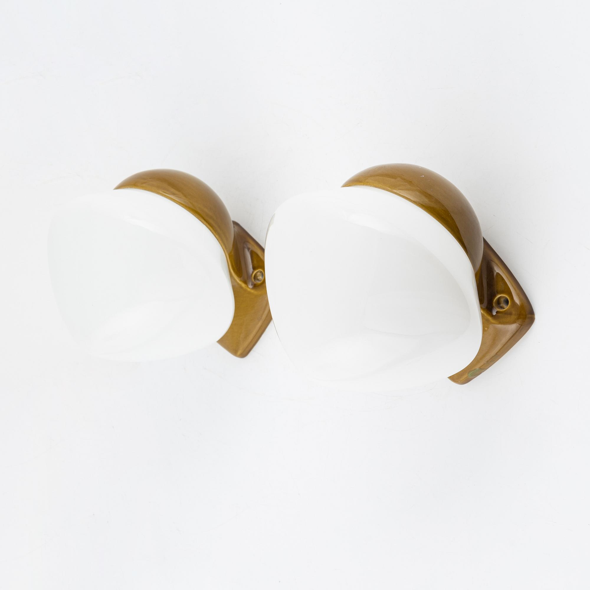 Gunnar Nylund, a pair of glass and porcelain wall lights from the 'Lyx' series, Ifö Electric, Sweden, 1960's.