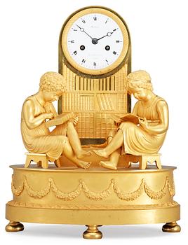 630. A French Empire gilt bronze mantel clock by Michelez.