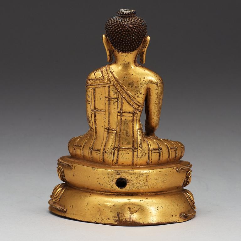 A gilt bronze figure of Buddha, Qing dynasty (1644-1911).