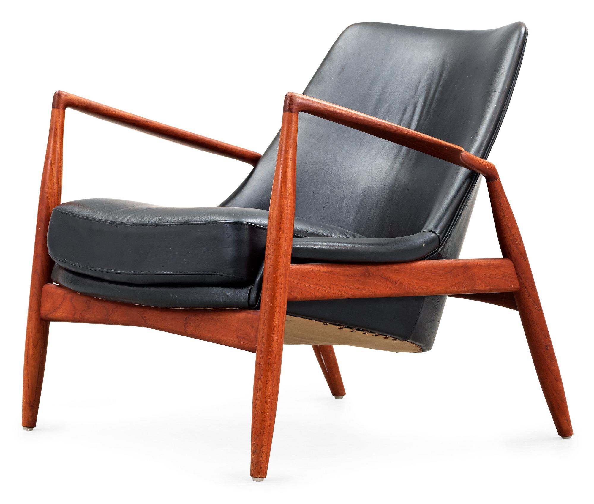 An Ib Kofod Larsen black leather and teak easy chair 'The Seal' by OPE, Sweden 1950-60's.