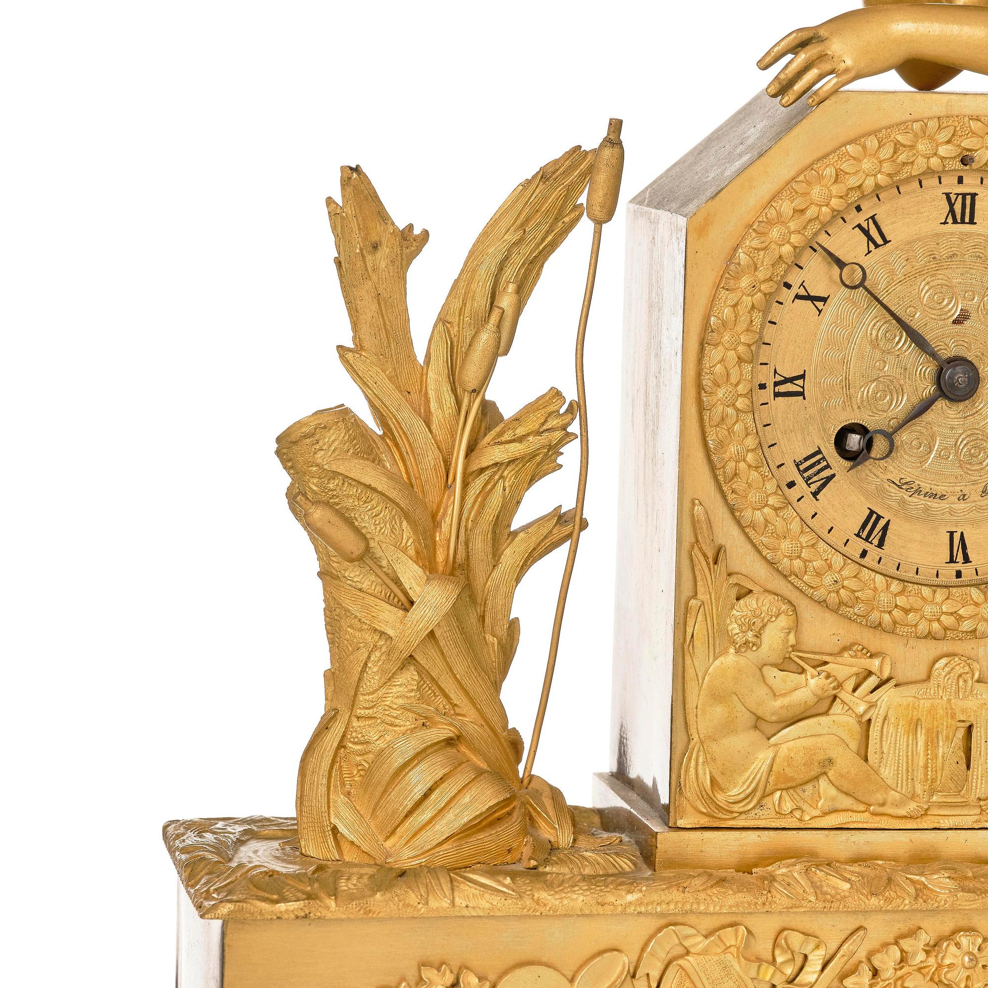 A French Empire ormolu and patinated bronze mantel clock, Paris, early 19th century.