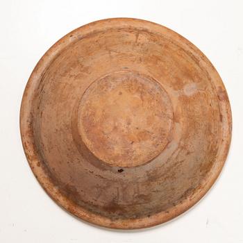 A earthenware dish, circa 1900.