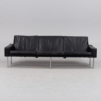 A Danish 1960´s Hans J. Wegner oak and leather sofa from Getama.