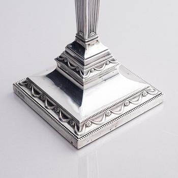 Four early 20th century silver candlesticks, marks of Hawksworth, Eyre & Co Ltd, Sheffield, England 1904-1906.