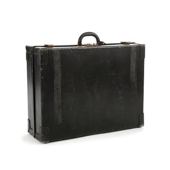 HERMÈS, a black leather suitcase from the 1950/60s.