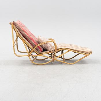 A rattan lounge chair from the secnd half of the 20th century.