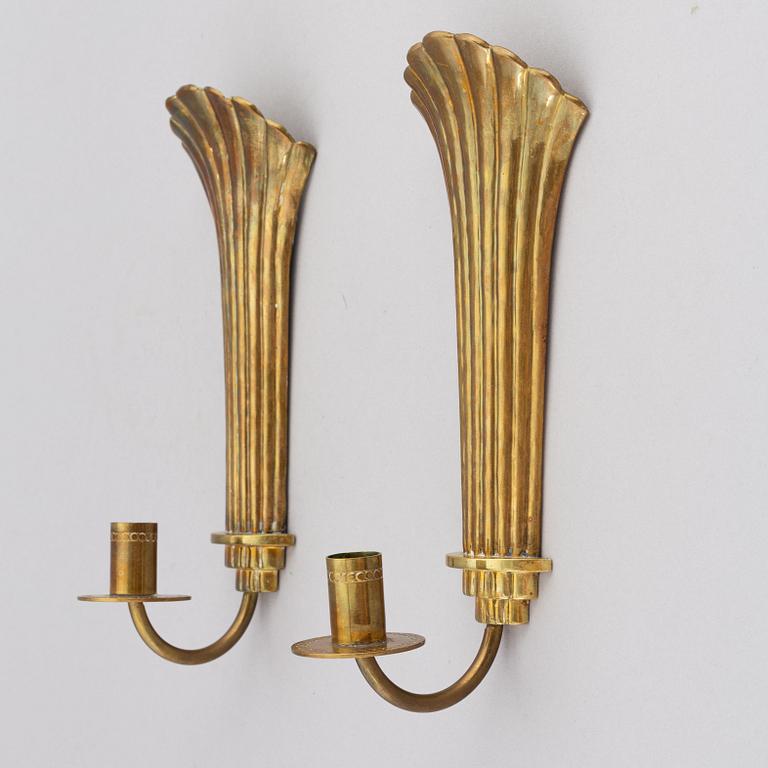 Lars Holmström, a pair of Swedish Grace brass wall sconces, Arvika, 1920's.