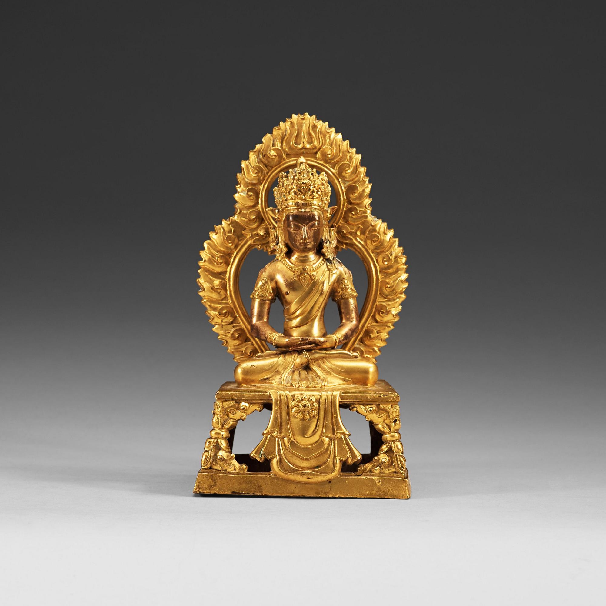 A gilt bronze figure of Bodhisattva, Qing dynasty, 18th Century. With inscription to base.