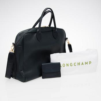 A Longchamp Briefcase and a Wallet.