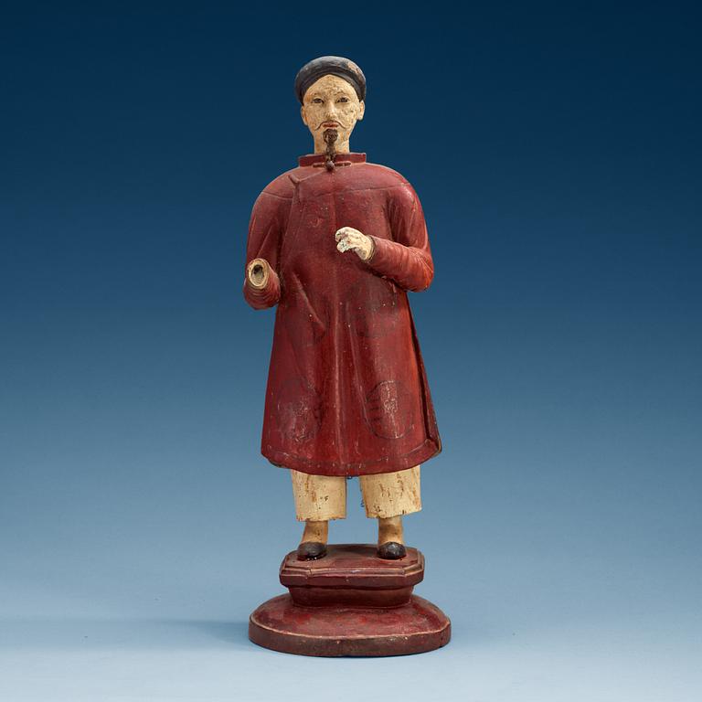A painted wooden export figure of a China man, Qing dynasty, 18th Century.