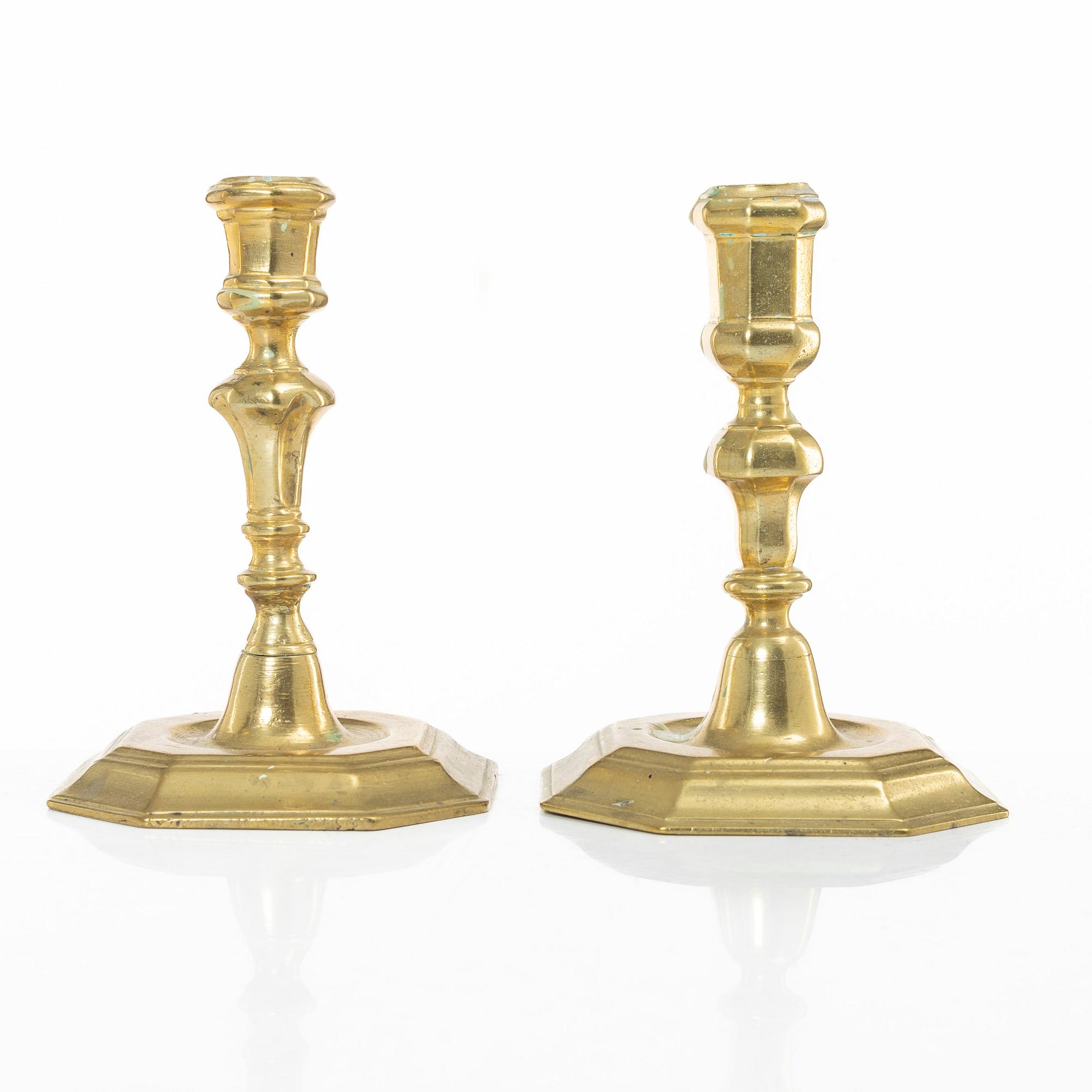 A set of two Northern European late baroque brass candlesticks, first part 18th century.