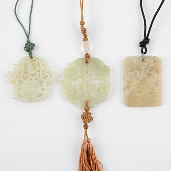 Three carved stone pendants, China, 20th century,