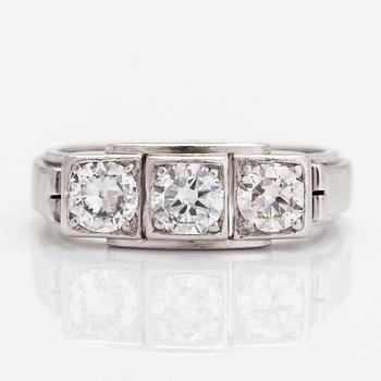 A.Tillander, a platinum three-stone ring, with brilliant-cut diamonds totalling approximately 1.18 ct.