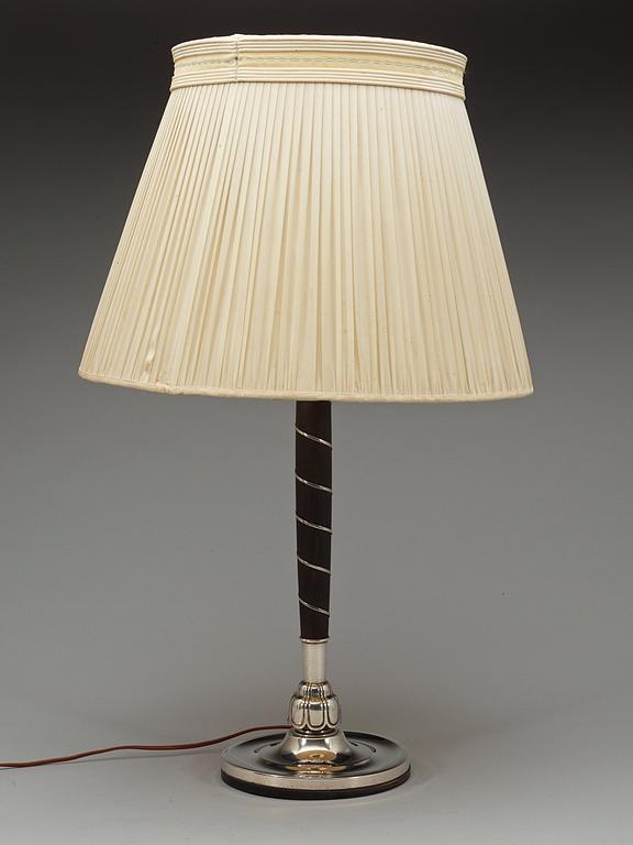 A C.G. Hallberg ebonized wood and silver table lamp, Stockholm 1928.