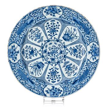 1319. A massive blue and white 'peacock' charger, Qing dynasty, early 18th century.