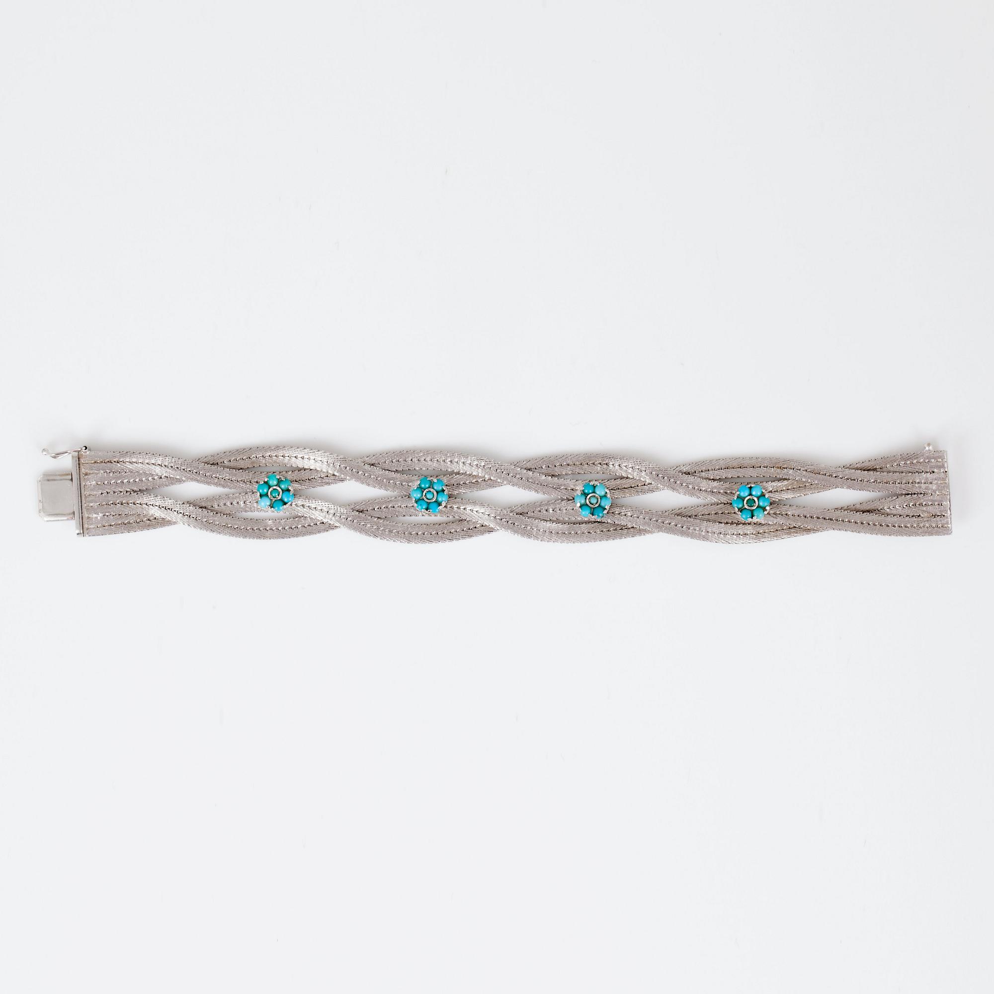 A turquoise and white gold bracelet.
