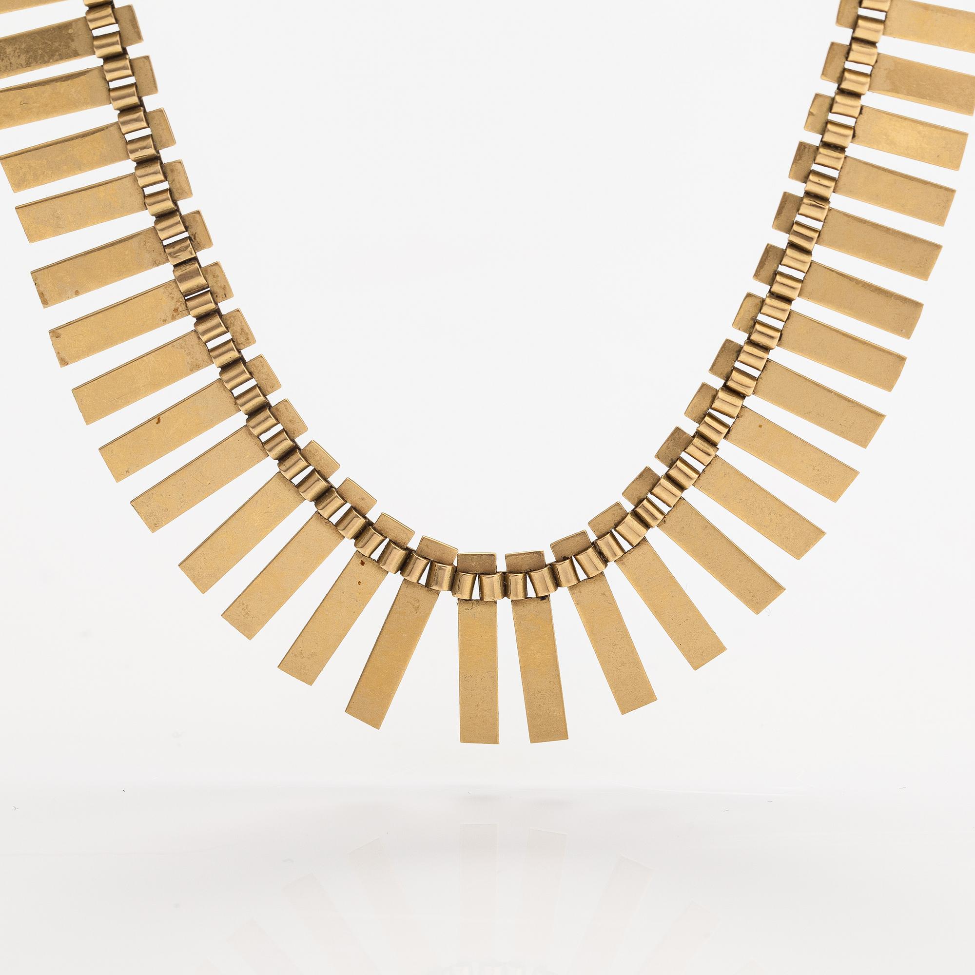 A 14K gold necklace. Import marked Koruteollisuus Tillander, Helsinki 1965.