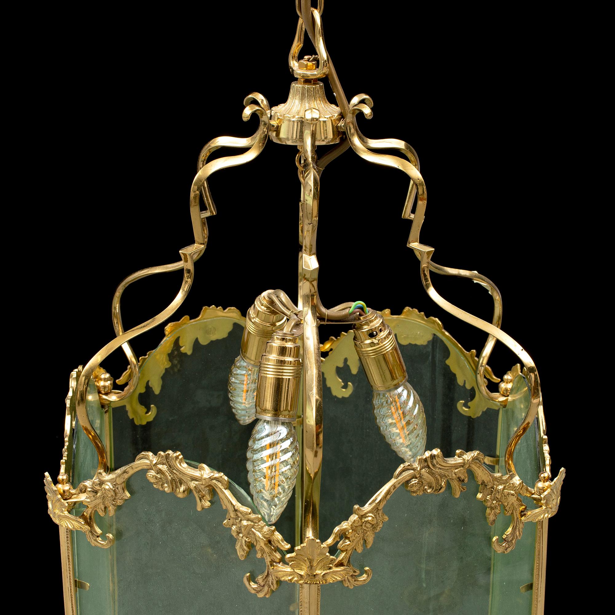 A brass ceiling light "Jubileumslyktan" by K.A. Jonsson, signed and dated 2002.