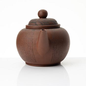 A 'calligraphy' yixing teapot, China, later part of the 1900s.