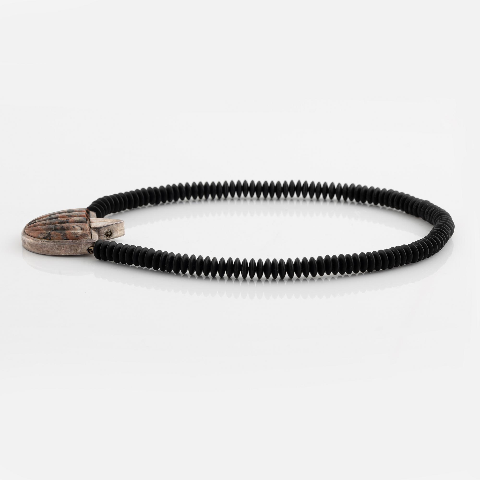 Gaudy necklace, silver and carved stone.