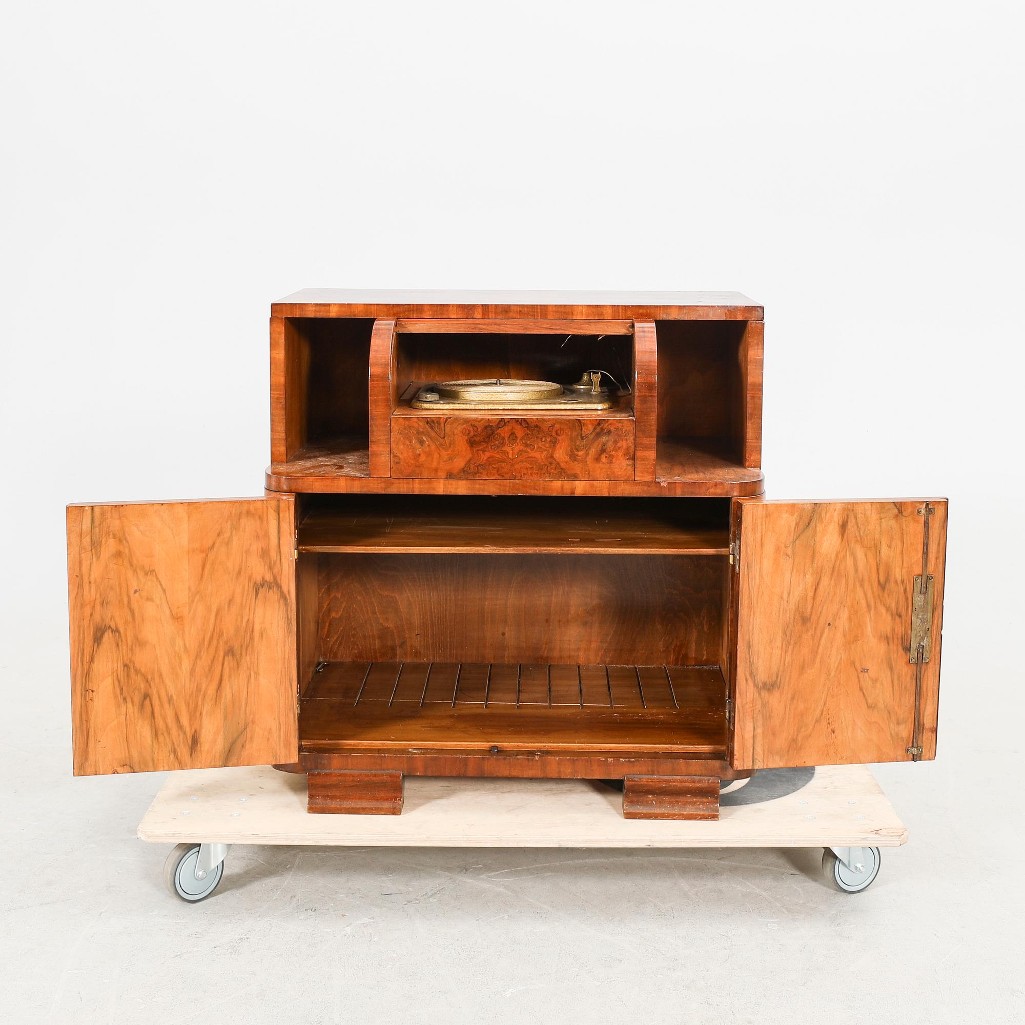 An Art Deco walnut cabinet/record player first half of the 20th century.