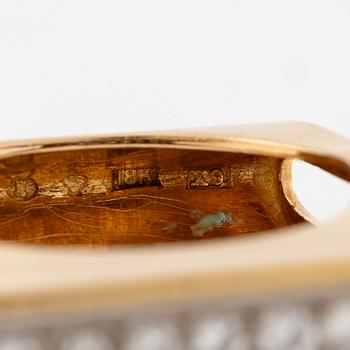 A W.A. Bolin ring in 18K gold set with round brilliant-cut diamonds.