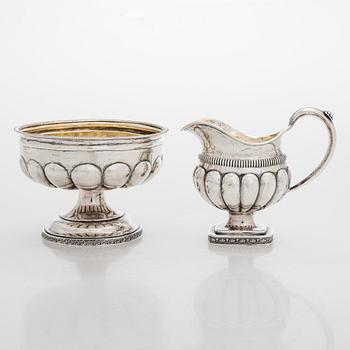 A silver cream jug by A.G. Illberg, Hamina, and a silver bonbonnière by Hj. Fagerroos, Helsingfors, 19th century.