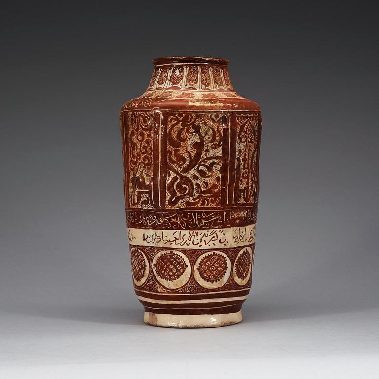 A JAR, lustre-decorated pottery. Height 32 cm. Central Persia (Iran) 12-13th century. Kashan style.