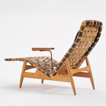 Arne Vodder, a woven leather lounge chair with attached side table, Bovirke, Denmark, 1950s.