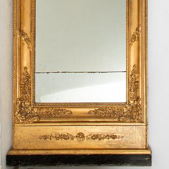 A rococo revival giltwood and parcel-gilt mirror, later part of the 19th Century.