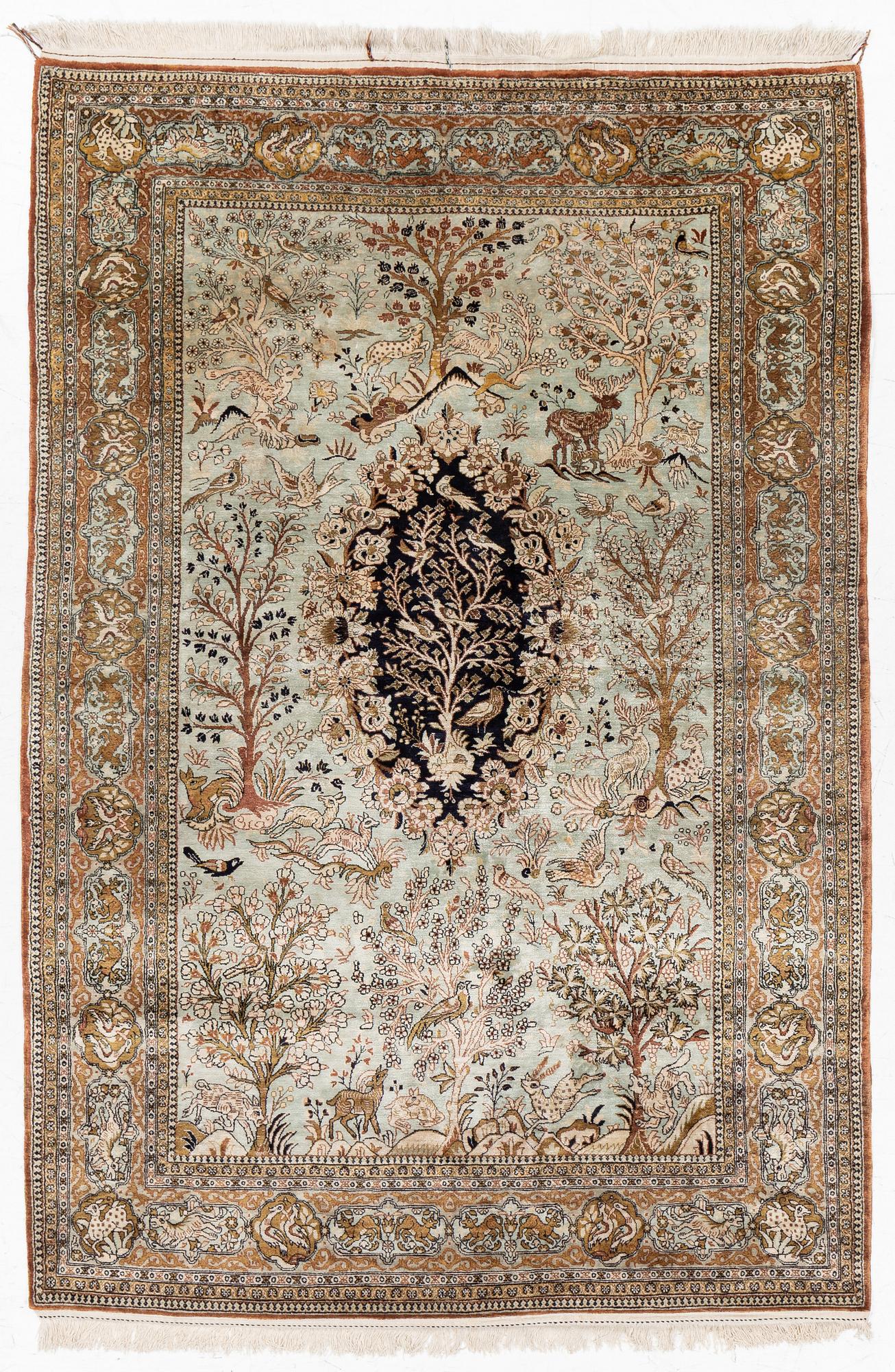 A Ghom, figural, silk rug, c. 205 x 140 cm.