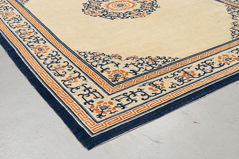 An antique Beijing carpet, measurement approx. 376 x 297 cm.