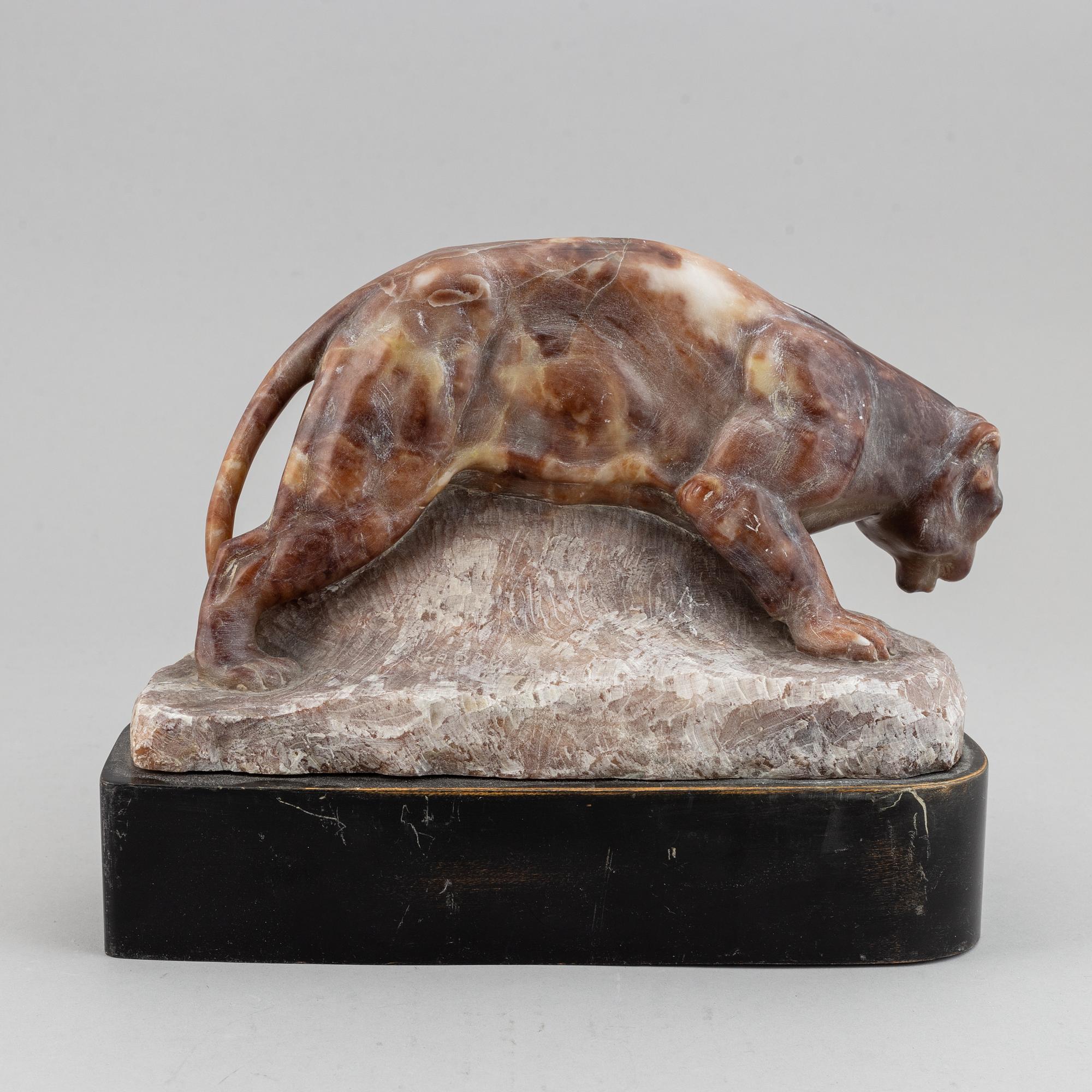 A 20th century stone sculpture of a panther.