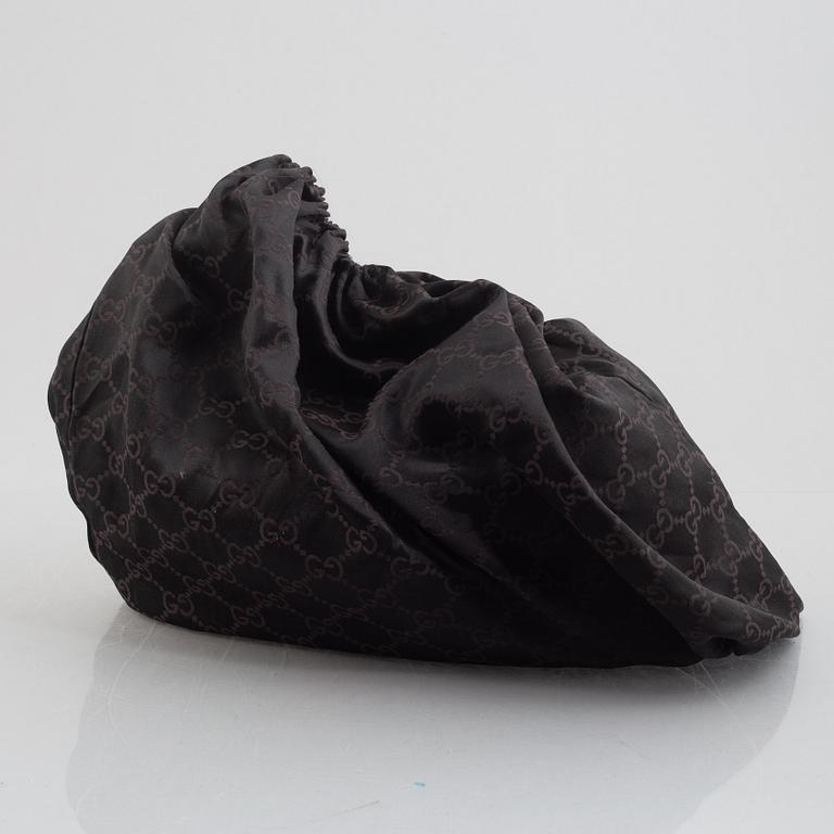 Gucci, a handbag.