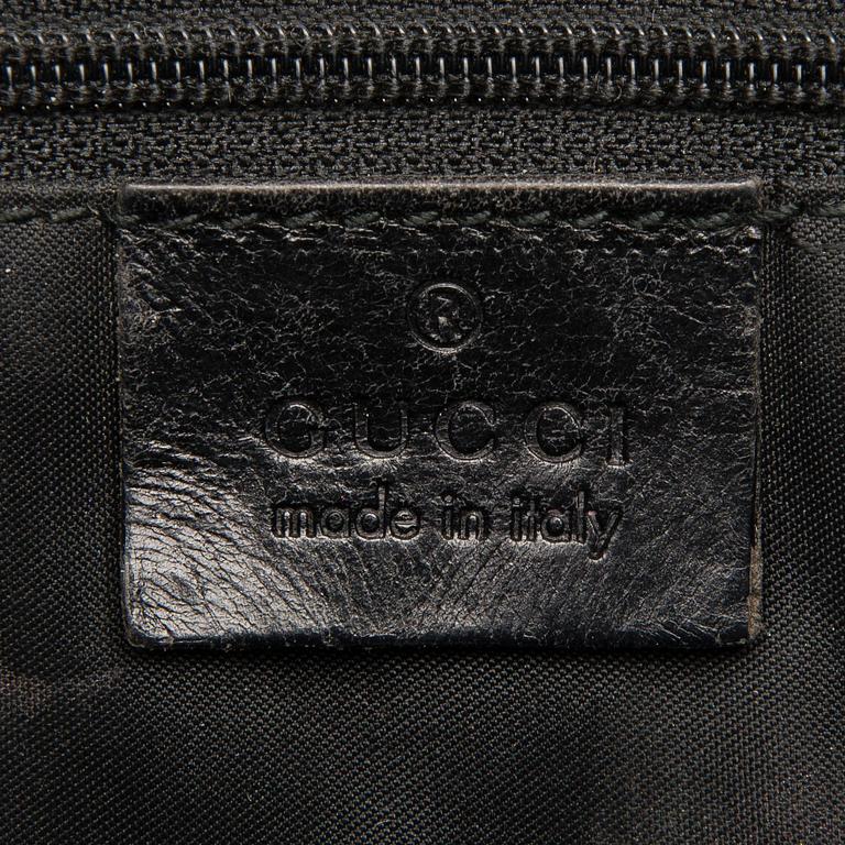 A Black Leather Jackie Bag.