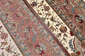 A part silk Tabriz carpet, so-called 50 Raj, approx. 356 x 250 cm.