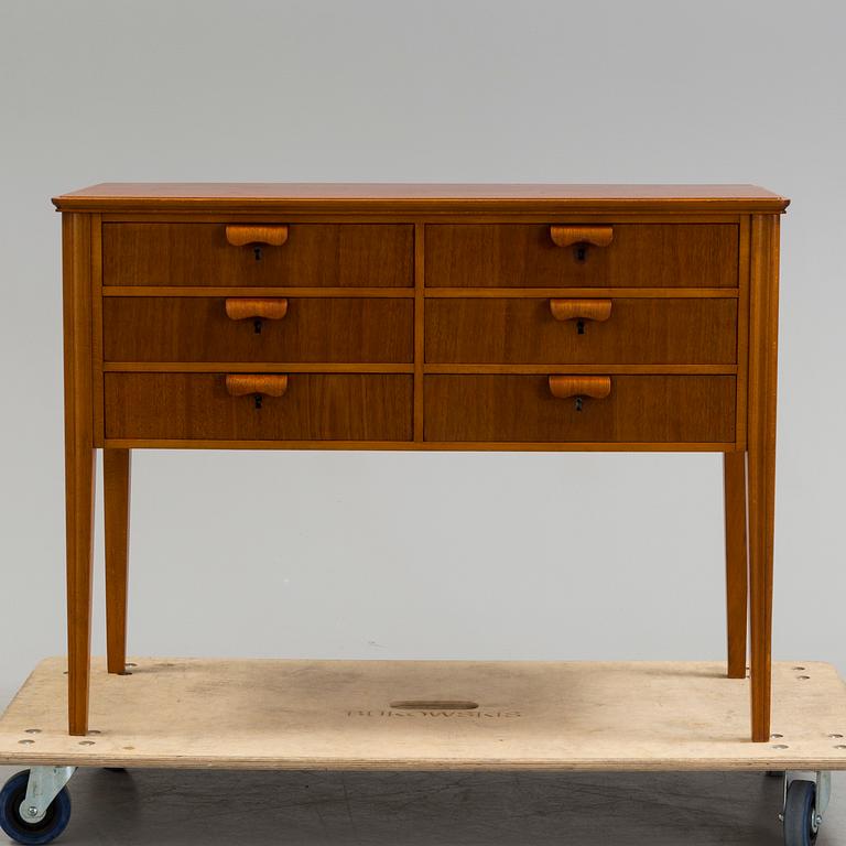 A 1960s teak veneered sideboard.