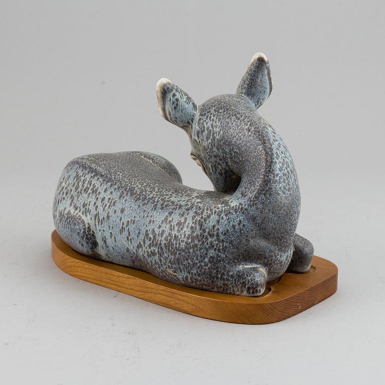 GUNNAR NYLUND, a unique stoneware sculpture of a reclining deer, Rörstrand, Sweden mid 20th Century.