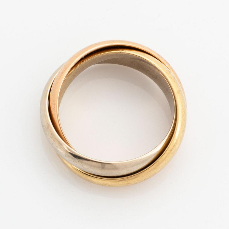 An 18K white, rose and yellow gold ring.