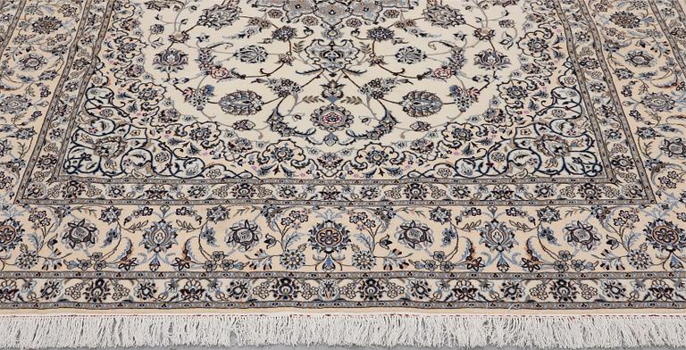 A Nain part silk carpet, 269 x 213 cm.