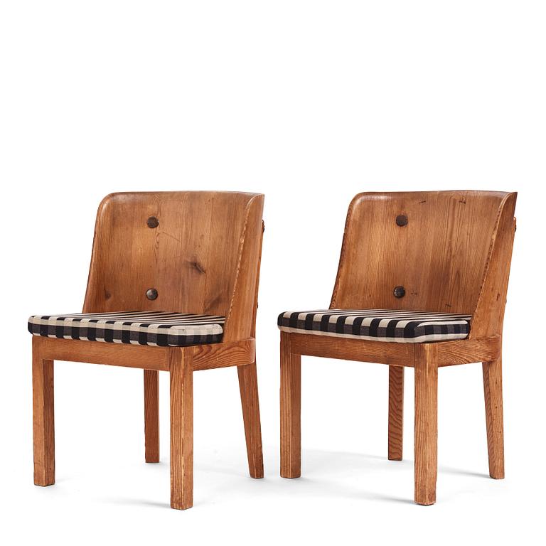 Axel Einar Hjorth, a pair of "Lovö" stained pine armchairs, Nordiska Kompaniet 1930s.