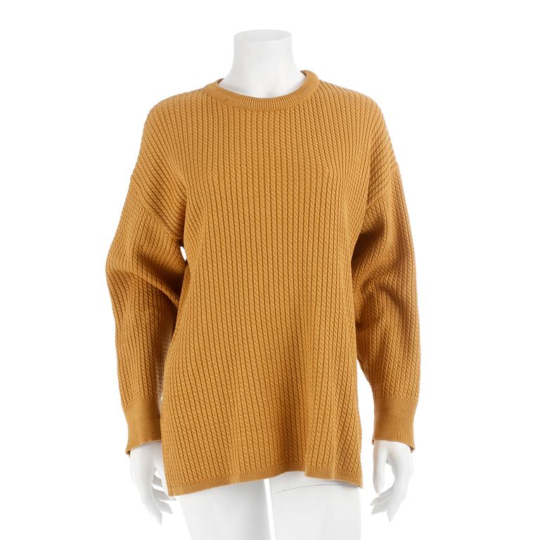 YVES SAINT LAURENT, a yellow mustard sweater, from the 1980s.