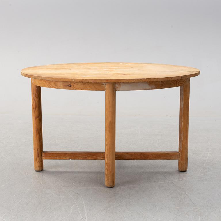 An early 20th century pine table by Nordiska Kompaniet.