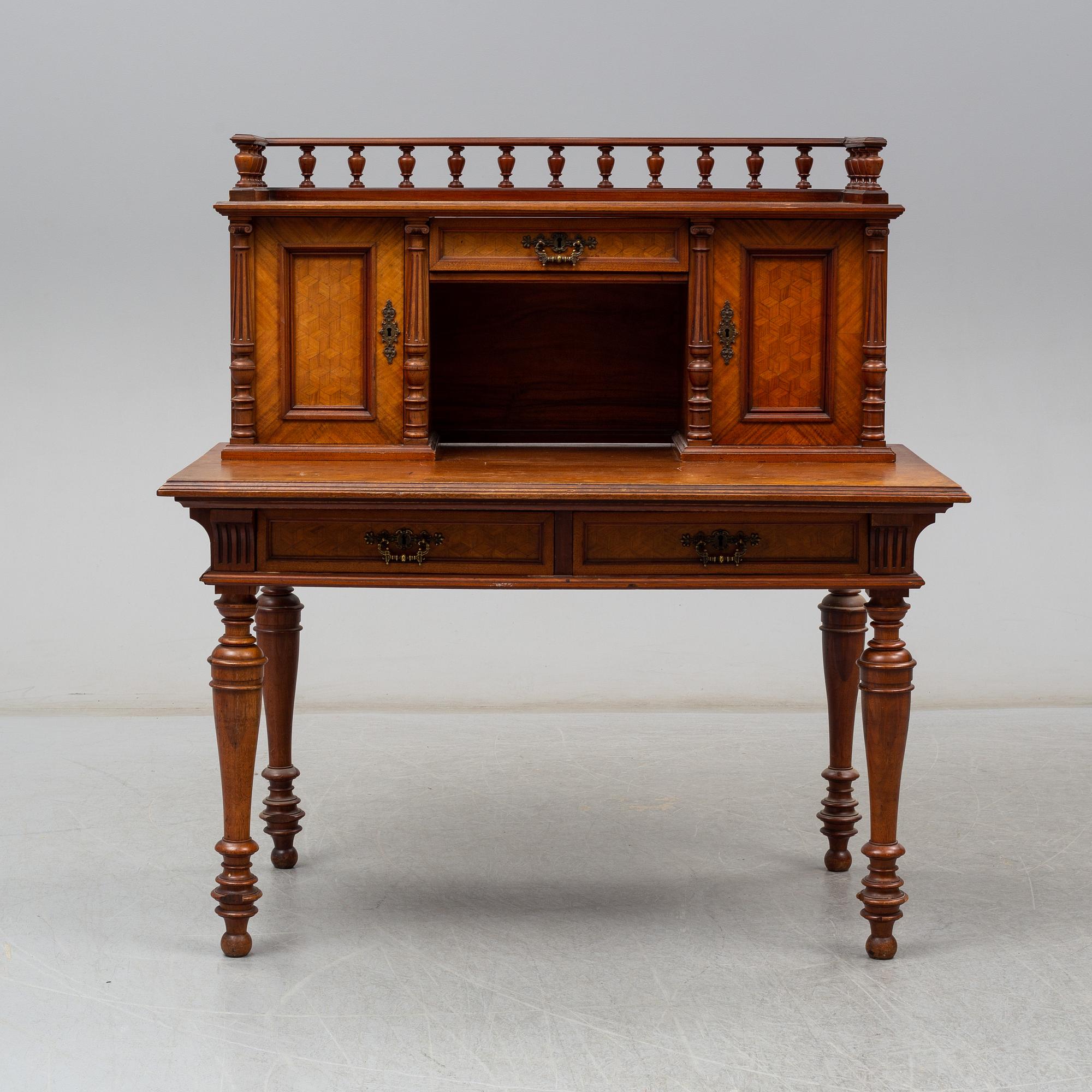 A late 19th century writing desk and armchair.