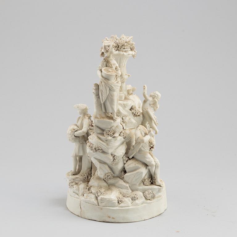 A porcelain figurine group circa 1900.